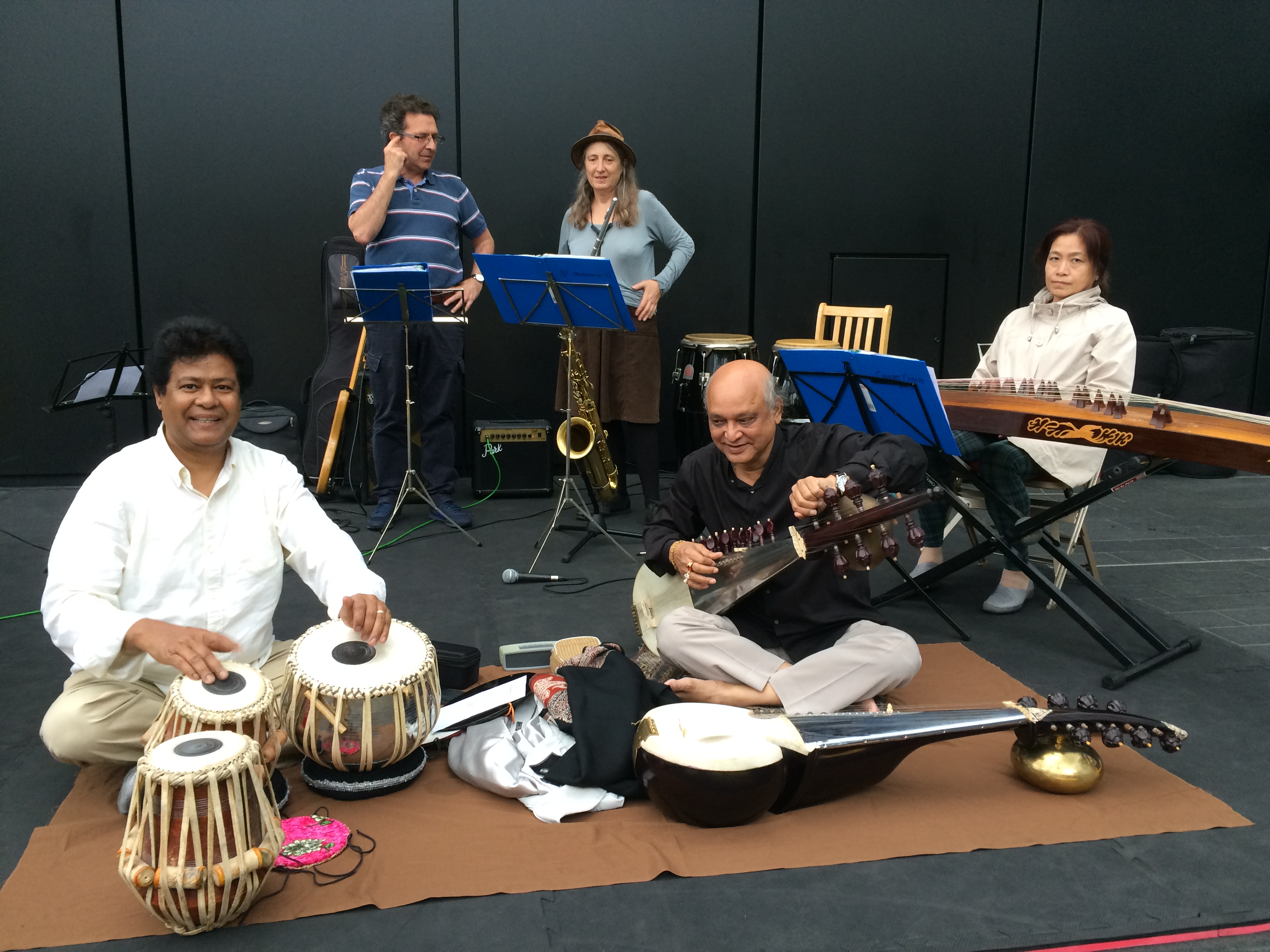 Yousuf guiding a young student at the tabla